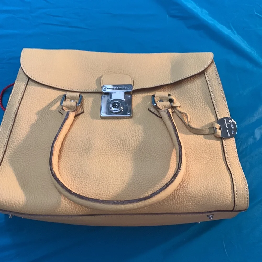 Almost New Dooney and Bourke Satchel with matching wallet. Rich Mustard Color
